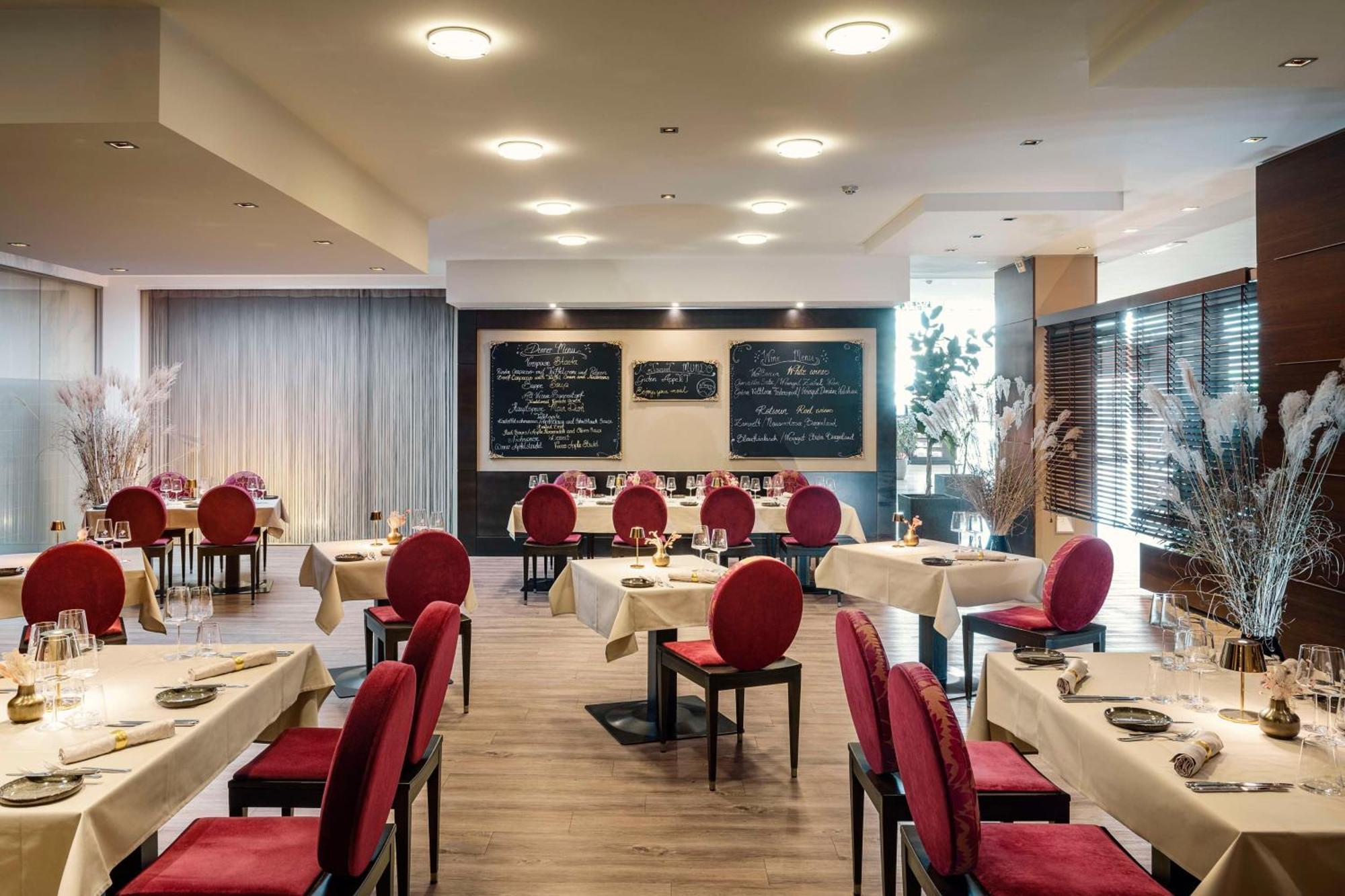 فندق إن إتش فيينا إيربورت كونفرانس سنتر سخويشات المظهر الخارجي الصورة Restaurant interior